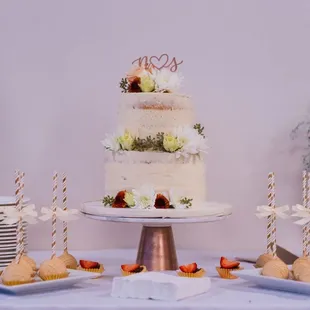 a wedding cake with strawberries and strawberries
