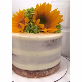 a cake with sunflowers on top