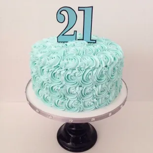 a cake with a number 21 on top