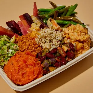 a container of rice, beans, and vegetables