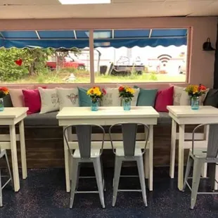 a table with four chairs and a bench