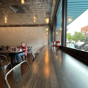 Dine at the long counter so you can enjoy the street view
