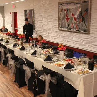 a long table set for a formal dinner