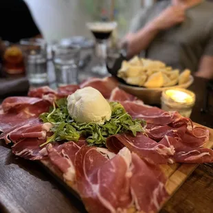 a platter of meat and cheese