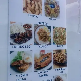 a menu on the side of a food truck