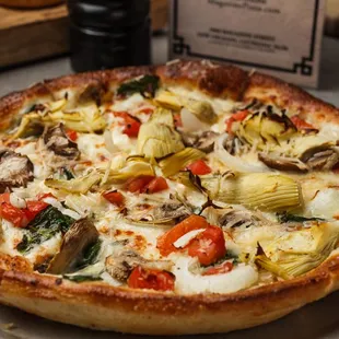 Spinach and artichoke gourmet pizza