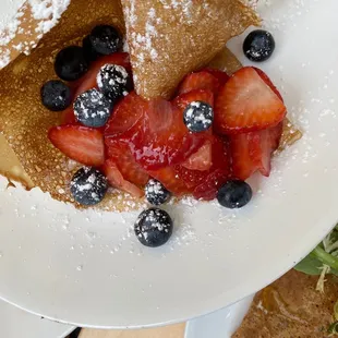 strawberries and blueberries on a plate