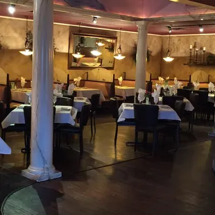 a restaurant with tables and chairs