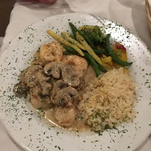 Shrimp and scallop sautéed with mushroom, cognac and cream sauce
