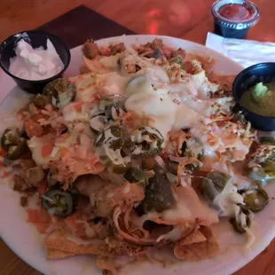 Smoked chicken nachos ($11) on Sundays or pork