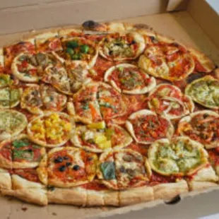 Piz-ception pizza. Ask owner Dan about this secret menu specialty featuring mini specialty pizzas as the topping! Hot pizza on pizza action!