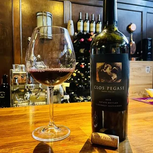 a glass of wine and a bottle of wine