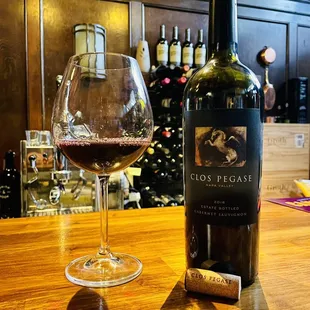 a glass of wine and a bottle of wine