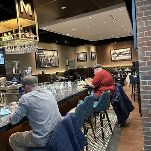 people sitting at the bar