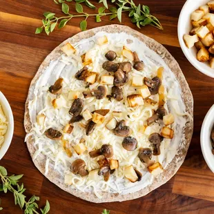 a pizza with mushrooms and cheese