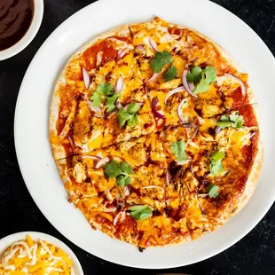 a pizza on a plate with toppings