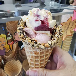 Strawberry Banana and Strawberry ice cream in a waffle cone.