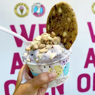 Regular size blueberry ice cream mixed with white Choc chips &amp; cookie dough &amp; topped with blueberry muffin cookie