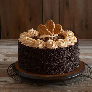 a chocolate cake on a wooden table