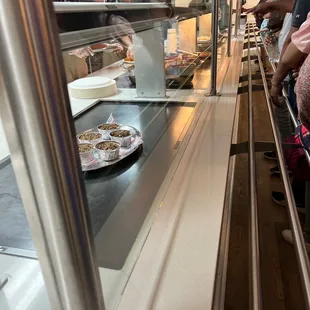 a line of people waiting to order food