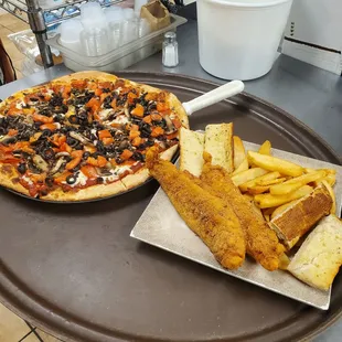 on the right is the fried catfish with amazing steak fries and garlic bread..yum yum