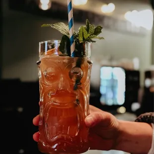 Sweet Tart Swizzle Lime juice, pomegranate juice, grapefruit juice, Zombie juice blend, cinnamon syrup, chocolate and rhubarb bitters