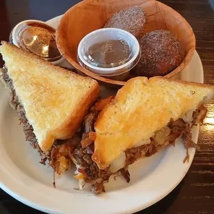 Brisket grilled cheese and backed biscuit and apple butter.