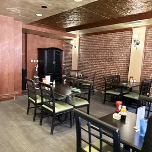 a dining room with tables and chairs