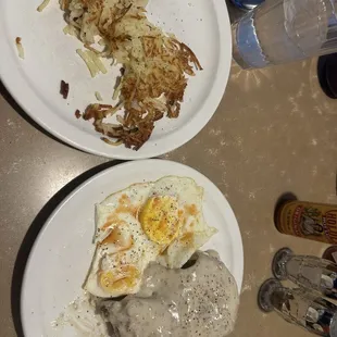Biscuits and pork sausage with grave, hash browns and eggs over easy, yumm!