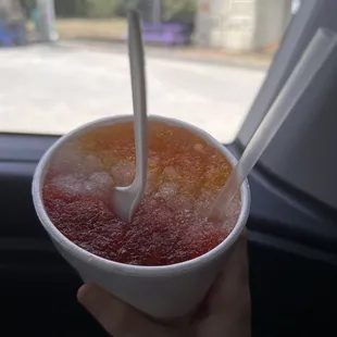 Orange, lemonade, and cherry snow cone