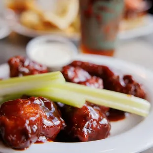 a plate of wings and celery