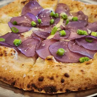 Raclette with purple potato over garlic creme fraiche