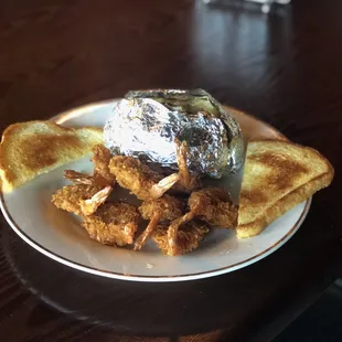 Coconut Shrimp, Baked Potato, and Texas Toast.