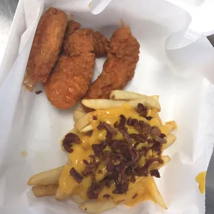 Chicken tenders, fries cheese and bacon