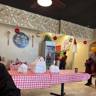 a table with a red and white checkered table cloth