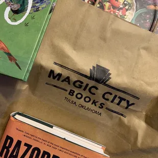 Our haul from Magic city books. Good things come in brown bags from bookstores.