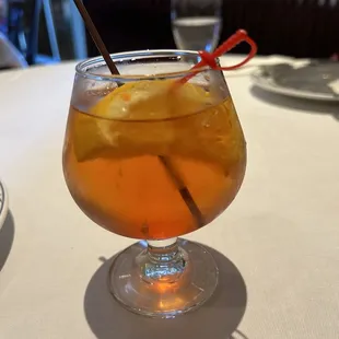 Manhattan cocktail was not served in a tumbler and was difficult to sip.