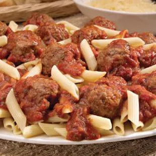 Penne pasta and handmade meatballs in a savory sauce, frozen and delivered.