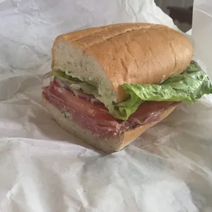 Build your own boar&apos;s head sandwich. Prosciutto, Genoa salami, Swiss cheese, tomato, onion, lettuce, salt/pepper, pesto mayo.