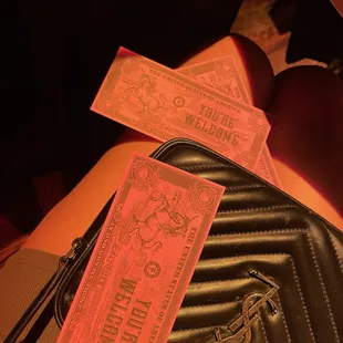 two tickets and a purse