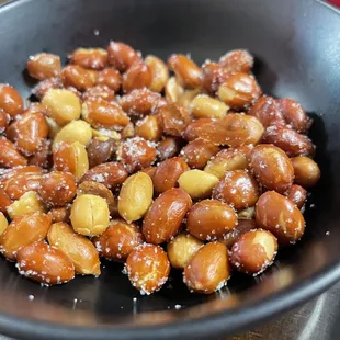 a frying pan filled with nuts