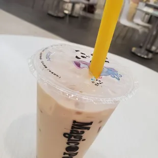 a drink in a plastic cup with a straw