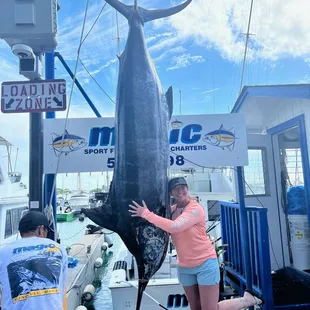 Me and my fish! It's 574 pounds and 130 inches!