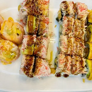 a plate of sushi and vegetables