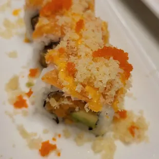 two pieces of sushi on a white plate