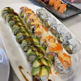 a platter of sushi and rolls