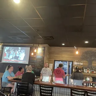 6 employees sitting at the bar while there were customers.