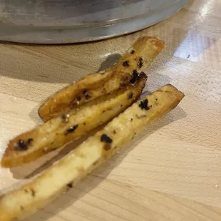 Fries cooked in dirty oil.
