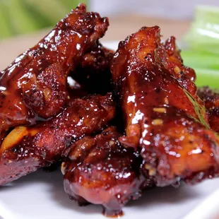 a plate of wings and celery