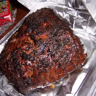 a large piece of meat in foil